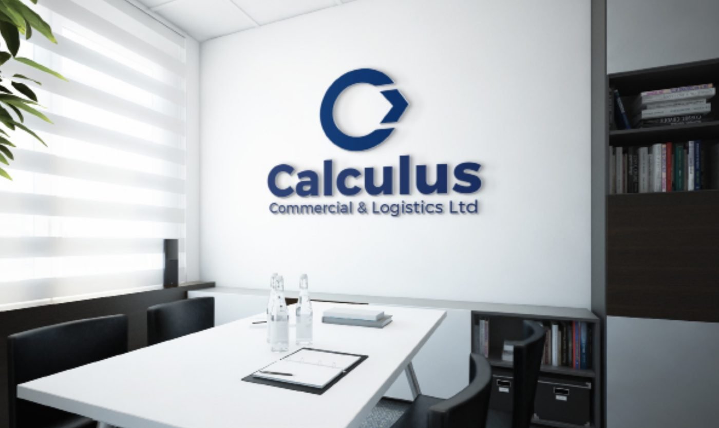 Calculus Commercial and Logistics logo mounted on a meeting room wall